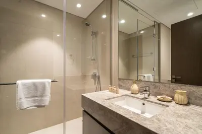a bathroom with a sink and a shower at Stunning 2BR with Full Burj View in the Opera District in Dubai