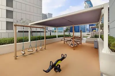 a pair of scissors on the roof of a building at Chic 1BR at Reva Stunning Canal Views in Dubai