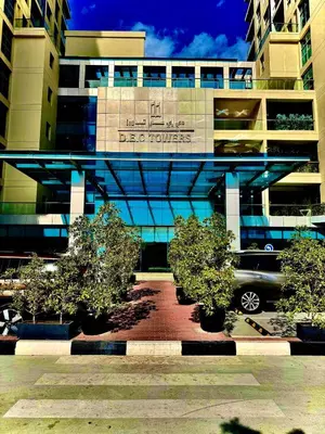 a building with trees in front of it at The Urban Retreat in Dubai