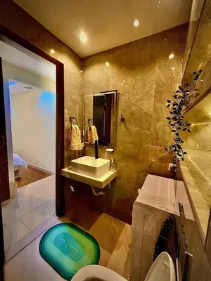 a bathroom with a sink and a mirror at The Urban Retreat in Dubai