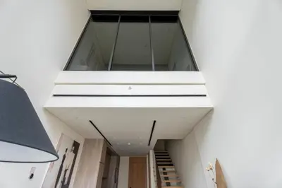 a stairwell in a house with a glass ceiling at GuestReady | Stylish 1BR Penthouse Retreat in Dubai
