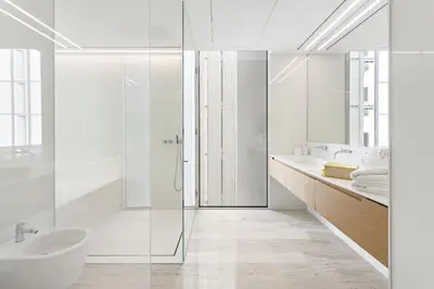 a white bathroom with a shower and a sink at VayK - Ultra Luxury Muraba Residences in Palm in Dubai