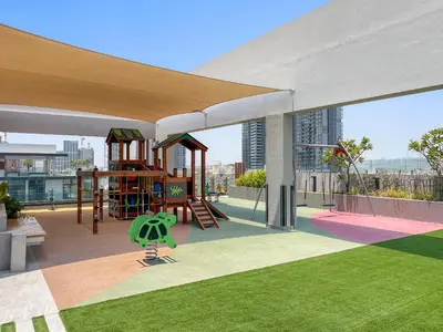 a playground on the roof of a building at VayK - Cozy Studio with a Balcony & Pool Views in Dubai
