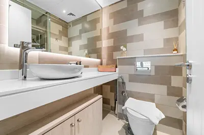 a bathroom with a sink and a toilet at VayK - Great 1BR with Beach Access in Dubai