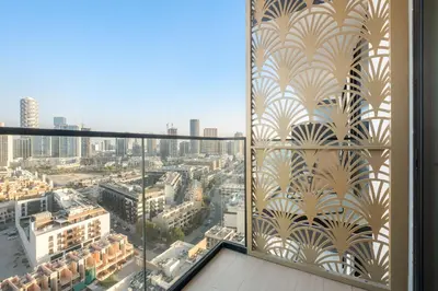 a window with a view of a city at VayK - Heavenly Brand New 1BR in Jvc in Dubai
