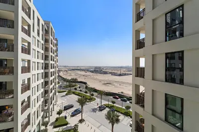 an aerial view of the beach from a building at VayK - Modern 1BR Getaway in Creek Harbour in Dubai