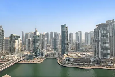an aerial view of a city with a river and buildings at VayK - Luxe 2BR with Stunning Marina Views in Dubai