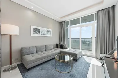 a living room with a couch and a table at Luxury 2BDR In Burj Khalifa View Business Bay in Dubai