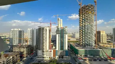 a view of a city with buildings under construction at AWS Holiday Homes - Stay in Style in Dubai