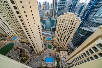 an aerial view of a city with tall buildings at Luxury Beachfront 4BR with Sea & Marina Views in Dubai