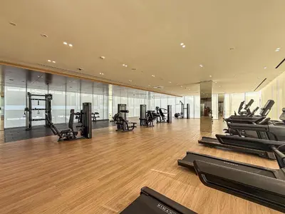 a gym with treadmills and elliptical machines at ALiving Brand New & Modern Studio I Binghatti Galaxy, JVC- G01 in Dubai