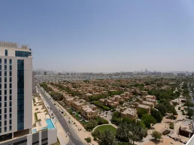 an aerial view of a city with buildings at Velvet Luxe Modern - 1BR w Private Pool in Gemz-15 in Dubai