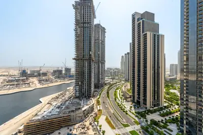 an aerial view of a city with tall buildings at New! Elegant 1BR Flat in Creek Harbour with Pool&Gym in Dubai