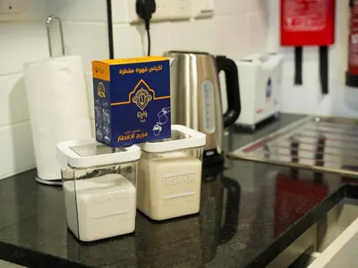 a box on top of a counter in a kitchen at 2BR Next to Metro and EXPO City GYM Pool Playground in Dubai