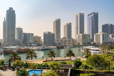 a view of a city with a river and buildings at New! Serene 2BR with Balcony & Pool in Sparkle Tower in Dubai