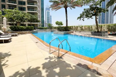 a swimming pool in the middle of a building at Silk Valley - Luxury 2BR in Downtown near Burj Khalifa & Dubai Mall in Dubai