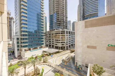 an aerial view of a city with tall buildings at Royal oceanic Dubai marina in Dubai