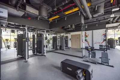 a gym with treadmills and machines in a room at Brand New Luxury Waterfront 2bd Beautiful Canal View in Dubai