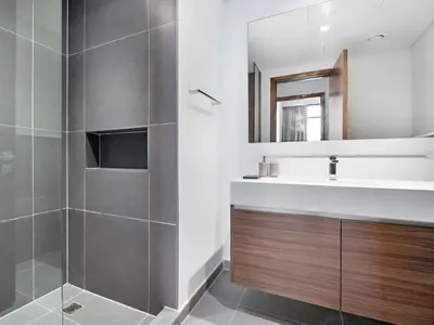 a bathroom with a sink and a mirror at Creek Harbour Gem Stylish 2BR with Stunning Views-17 in Dubai