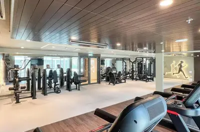 a gym with treadmills and cardio equipment in a building at Creek Harbour Gem Stylish 2BR with Stunning Views-17 in Dubai