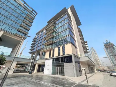 a tall building on the corner of a street at 2BR plus M CF7 B Partial Canal View in Dubai