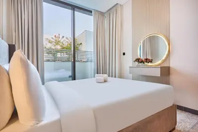 a bedroom with a large bed and a mirror at STAY BY LATINEM Luxury 1BR Holiday Home CB 0618 Near Burj Khalifa in Dubai