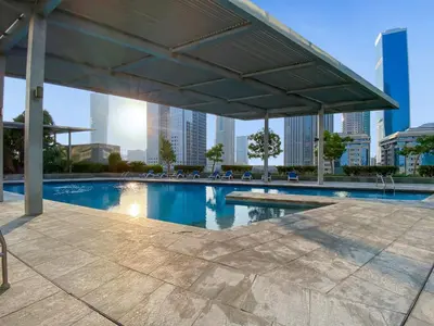 a swimming pool with a view of the city at Silkhaus Entrepreneur Work & Stay Studio in DIFC in Dubai