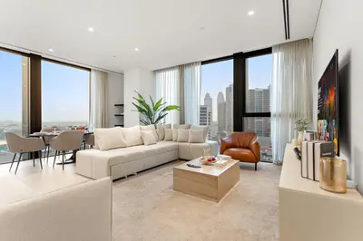 a living room with a couch and a table at Spacious 2BR in Business Bay with Canal View in Dubai