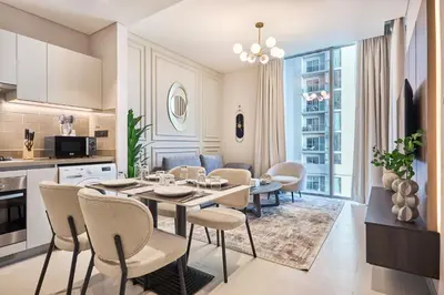 a kitchen and dining room with a table and chairs at STAY BY LATINEM Luxury 1BR Holiday Home CV A 907 near Dubai Mall in Dubai
