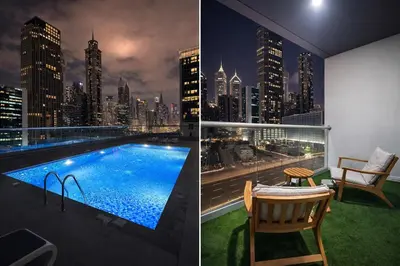 a hotel room with a view of a city skyline at Prime Apartments Near WTC and Sheikh Zayed RD in Dubai