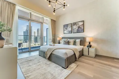 a bedroom with a large bed and a large window at High-Floor Balcony with Burj Khalifa View and Assistant Room, Minutes from Burj Plaza & Dubai Mall, Easy Access to Downtown Attractions, Imperial Avenue, Downtown Dubai by Deluxe Holiday Homes in Dubai