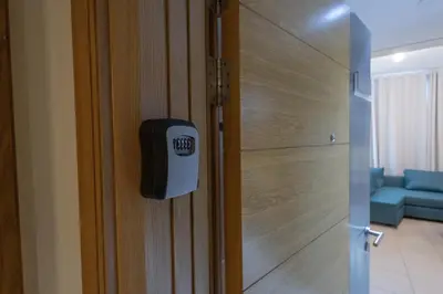 a door with azo sign on it next to a room at Downtown 1BHK apartment with City view in Dubai
