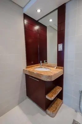a bathroom with a sink and a mirror at Downtown 1BHK apartment with City view in Dubai