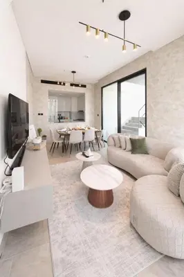 a living room with two couches and a table at Private Pool I Sleeps 6 I 5 Star Amenities I 2BR Onyx in Dubai