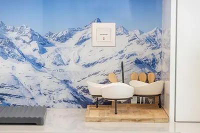 a bathroom with a snow covered mountain mural at Canal Front Luxe, Elegant 2BR with Water Views in Dubai