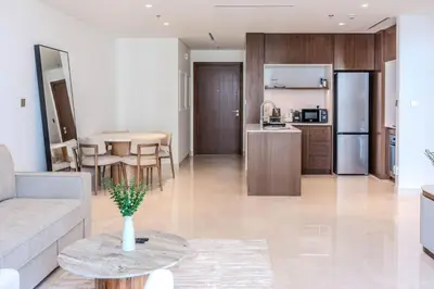 a living room and kitchen with a couch and a table at Dubai Harbour Marina View with Beach Access in Dubai