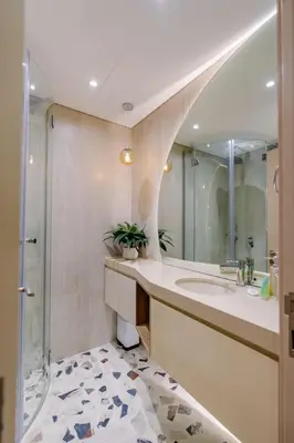 a bathroom with a sink and a shower and a mirror at Sunny Studio - Dubai Marina - Close Beach in Dubai