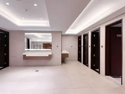 a large room with a sink and a mirror at Elite Downtown Residence, Downtown Dubai - Onelink in Dubai