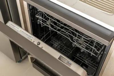 an oven with a dish rack inside of it at New Elegant 1BR with Balcony & Pool in Park Field in Dubai