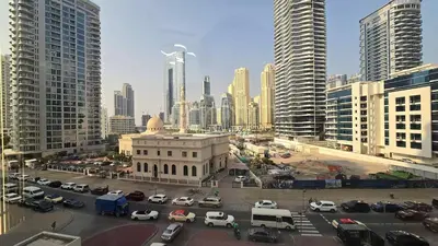 a city with cars parked in a parking lot at Luxury 2BHK in Dubai Marina Escan 402 in Dubai