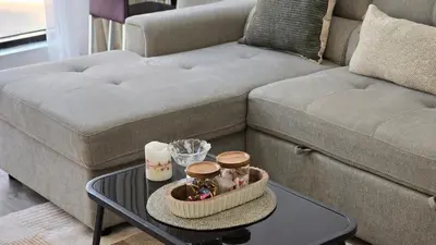 a living room with a couch and a coffee table at Luxury 2BHK in Dubai Marina Escan 402 in Dubai