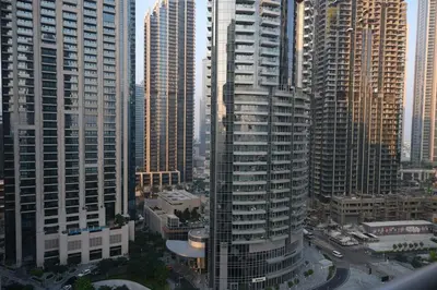 an aerial view of a city with tall buildings at Cozy 1BR Near Burj Khalifa and Dubai Mall in Dubai