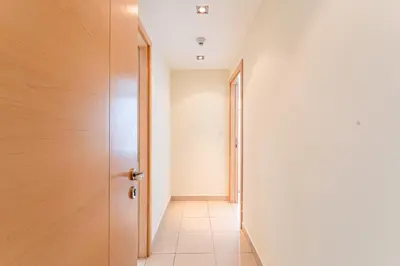 an empty corridor with a door at HAVN - 2 bedroom in Marina with Dubai Marina View in Dubai