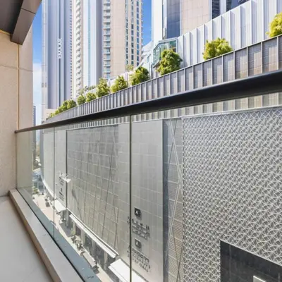 a balcony with a view of a city at Dunya Tower in Dubai