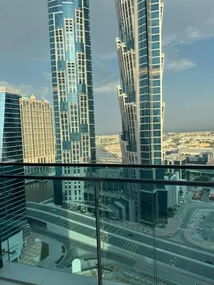 a view of a city with tall buildings and a highway at 1BR Canal Views Large Balcony Spacious BusinessBay in Dubai