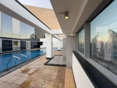 an indoor pool with a view of the city from a building at Sky Gardens By Luxe Living Collection - Duplex 2BR - DIFC in Dubai