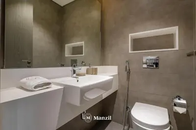 a bathroom with a sink and a toilet at 1BR Urban Living near Downtown in District One in Dubai