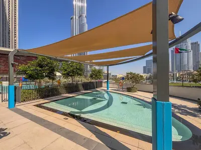a swimming pool on the roof of a building at Frank Porter - Grande Signature in Dubai