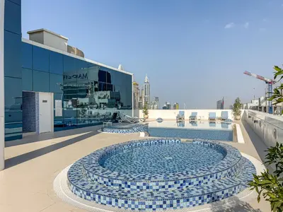 a swimming pool in the middle of a building at Stylish JLT Studio in Dubai