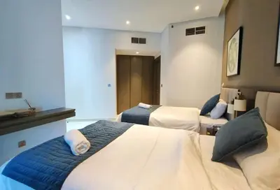 a hotel room with two beds in a room at Amazing Canal View 2 BR sweet retreat in Dubai